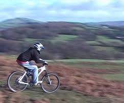 Is the bike rider in the picture above demonstrating kinetic energy or potential energy? you need t