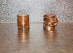 The stack on the left is made up of 15 pennies, and the stack on the right is also made up of 15 pen