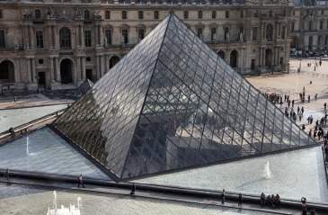 The entrance to the louvre museum in paris, france, is a square pyramid. the side length of the base