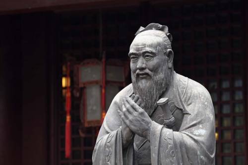 What is the main topic discussed in the analects of confucius?  a.  proper behavior and ideals b.  s