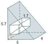Arectangular prism with a square base is cut from the center of a triangular prism. each side of the
