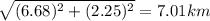 \sqrt{(6.68)^2+(2.25)^2}=7.01 km