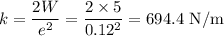k=\dfrac{2W}{e^2}=\dfrac{2\times5}{0.12^2}=694.4\text{ N/m}