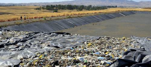 How is sanitary landfill different from open dump