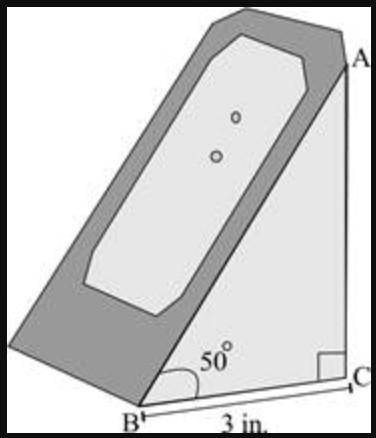 The picture below shows a right-triangle-shaped charging stand for a gaming system:

The side face o