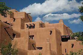 How did the buildings of the Pueblo reflect their relationship with the environment