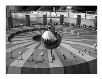 The photograph below shows a foucault pendulum at a museum. the pendulum knocks over pins in a regul