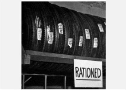 Rationing of tires shown in the photograph is most likely to be caused by