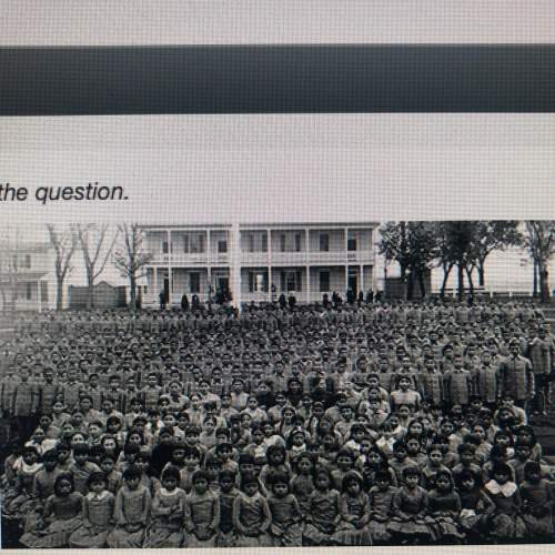 Use the image to answer the question. m the picture shows native american children in fr