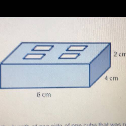 A building block is made by taking a 6 cm by 4 cm by 2 cm block and removing four cubes from the cen