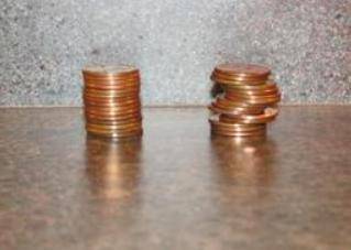 PLS HELP ASAP! WILL GIVE BRAINLIEST The stack on the left is made up of 15 pennies, and the stack on