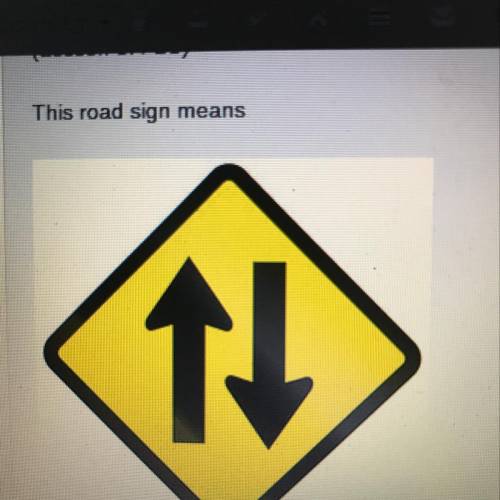 This road sign means  A. You may turn either left or right B.yield the right of way ahead C.two way