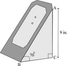 The picture below shows a right-triangle-shaped charging stand for a gaming system: The side face o