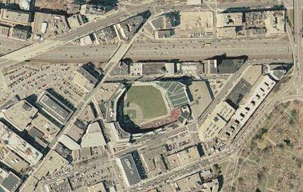 The photo above is a satellite picture of Boston. Write a paragraph of at least 5 sentences in whic