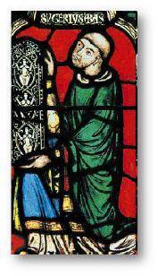What is Abbot Suger holding in the image below? A stained glass window of a bald man on his knees h