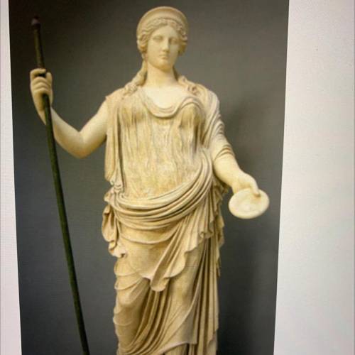 (20 points) What is Hera holding in her left hand?

A. Discus
B. Grain measure
C. Mirror
D. A liba