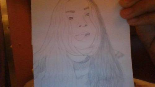 Heres a pic of my friend and a drawing that i drew from her

it didnt take long i put the paper ov