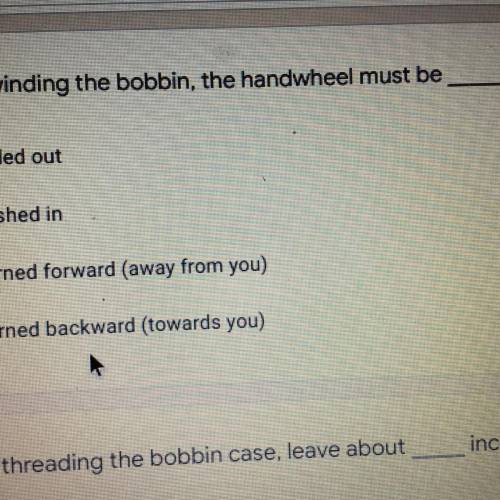 When winding a bobbin, the hand wheel must be?