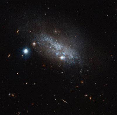 What type of galaxy is pictured?

Image of a galaxy that has no recognizable shape or features
© 2