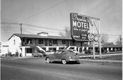 Using the picture provided, how did the automobile influence the hotel industry?

A. Motels could