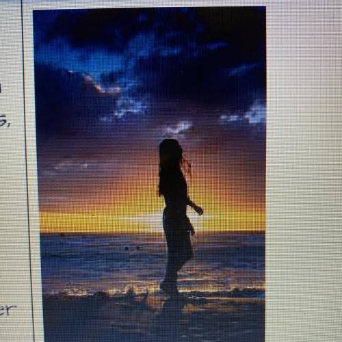 Write a poem about a girl enjoying a sunset at the beach
