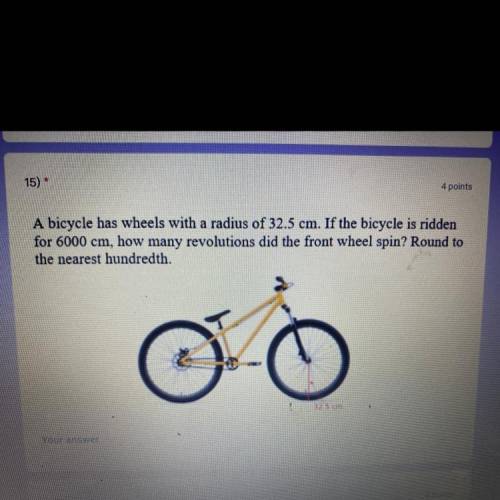 A bicycle has wheels with a radius of 32.5 cm. If the bicycle is ridden

for 6000 cm, how many rev